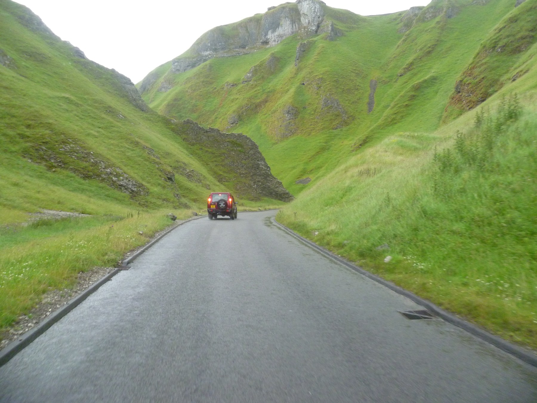 Winnats Pass near Castleton, where exposed limestone makes the White Peak’s bedrock easy to see.